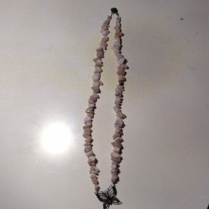 Rock with butterfly necklace